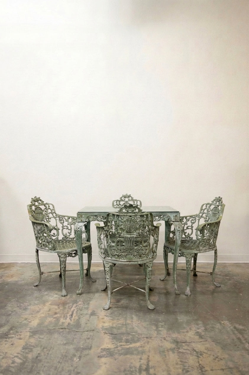 Antique cast iron garden table and 3 chairs set with ornate scrollwork in verdigris green