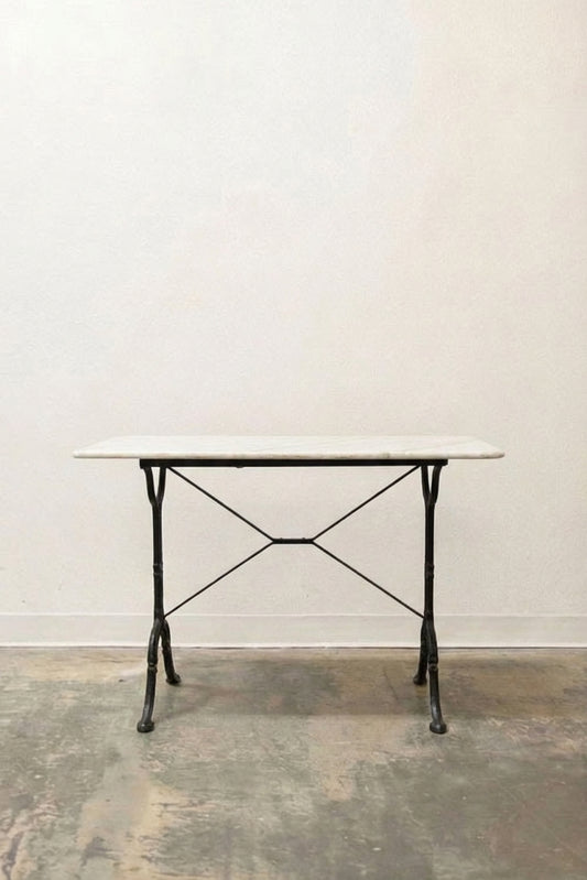French bistro cafe table with white marble top and black wrought iron base