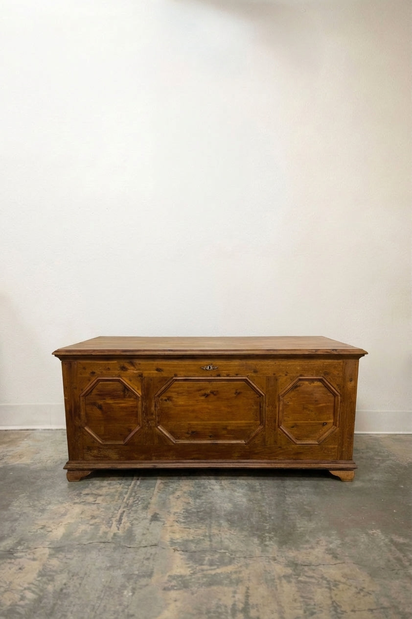Antique pine blanket chest with three octagonal carved front panels and bracket feet